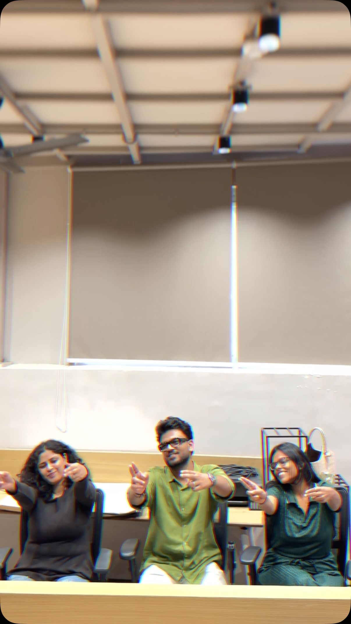 Three members of the Wabi Sabi Studio team at their desks in the Surat office